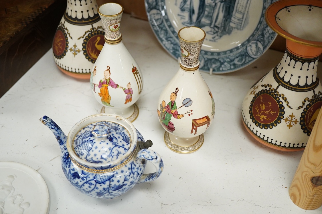 A pair of Copenhagen biscuit relief plaques of Night and Day, after Thorvaldsen, 15cm diameter, plus two pairs of vases, a blue and white plate and teapot (8)